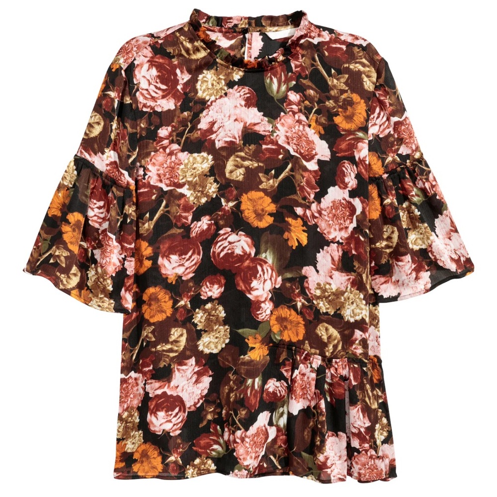 Short sleeve mockneck soft floral top w/ asymmetrical peplum detail